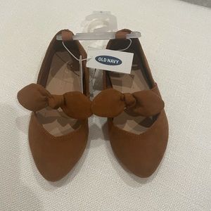Brown slip on bow shoes